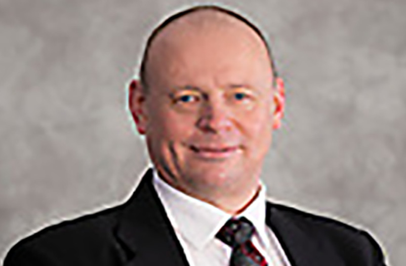 Anthony M. Calafaty professional headshot wearing a suit and tie.